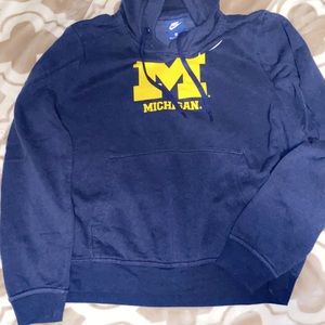 Blue Nike Michigan hoodie.